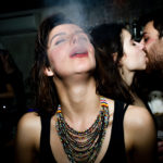 photograph printed girl smoking with guys kissing at night